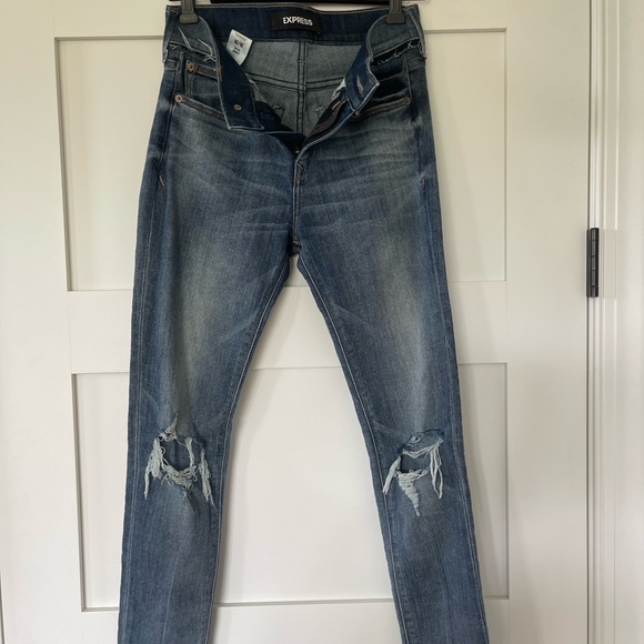 Express skinny, distressed, mid rise jeans.